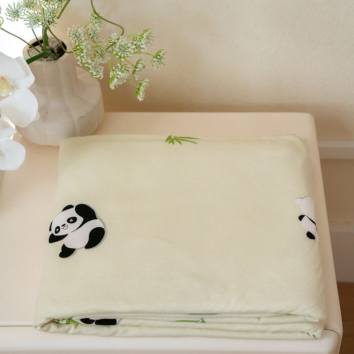 Organic Cotton Muslin Swaddle Blanket with Playful Cartoon Print