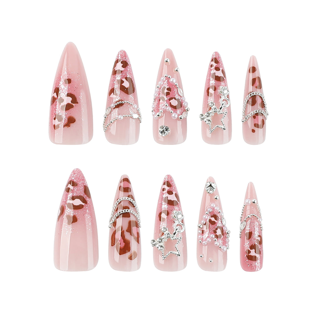 Artistic stiletto nails with glitter and jewelry accents Stornfield