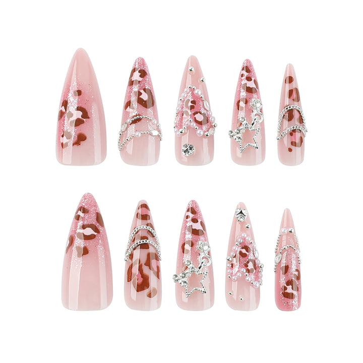 Artistic stiletto nails with glitter and jewelry accents Stornfield