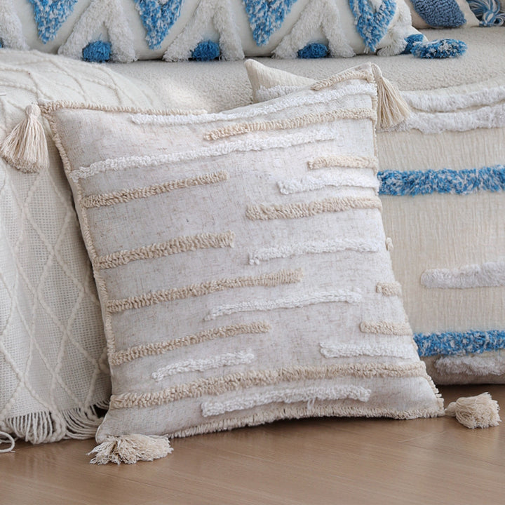 Square handwoven cushion cover made of cotton-linen with raised stripe tufting and corner tassels Stornfield