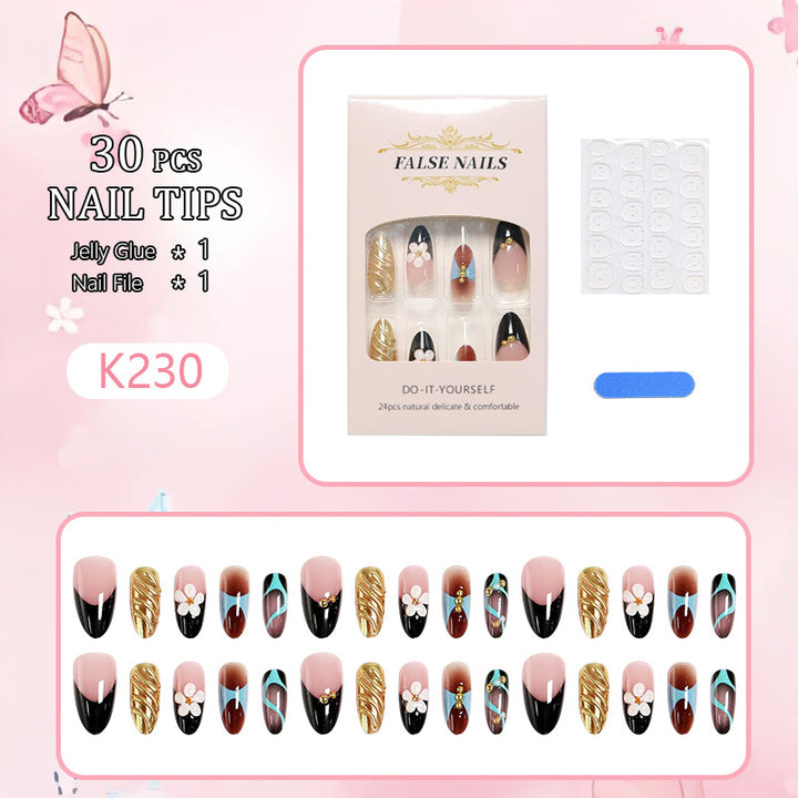 Artificial nail set with filigree floral decorations and glamorous accents Stornfield
