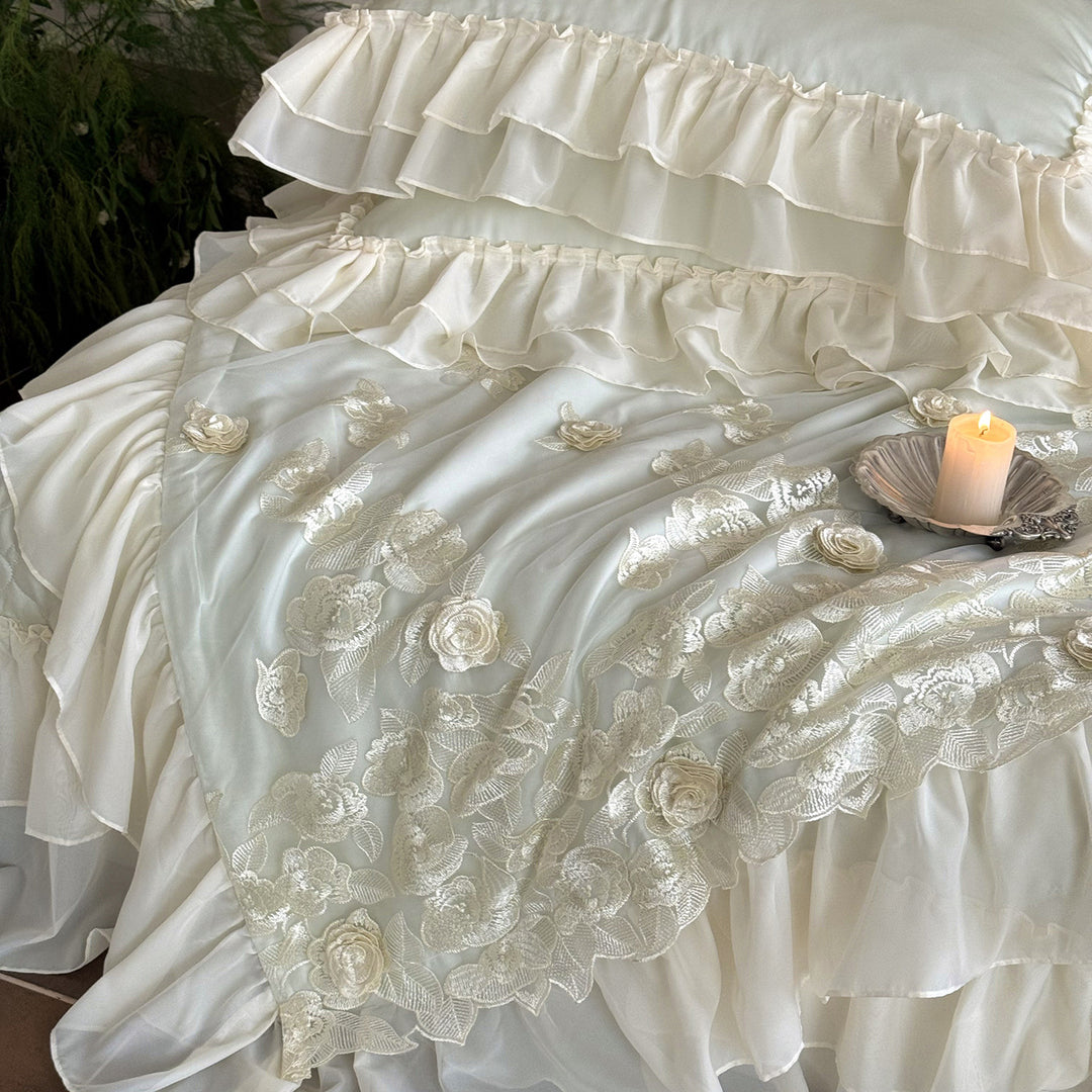 Romantic bedding set with quilted bedspread, ruffled pillow and floral embroidery