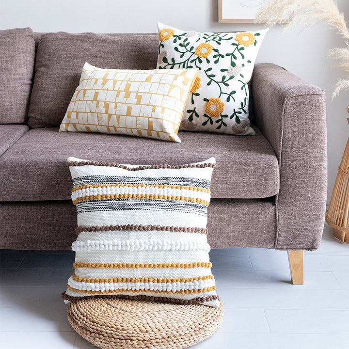 Embroidered square cushion cover made of cotton-linen with tufted flower appliqué