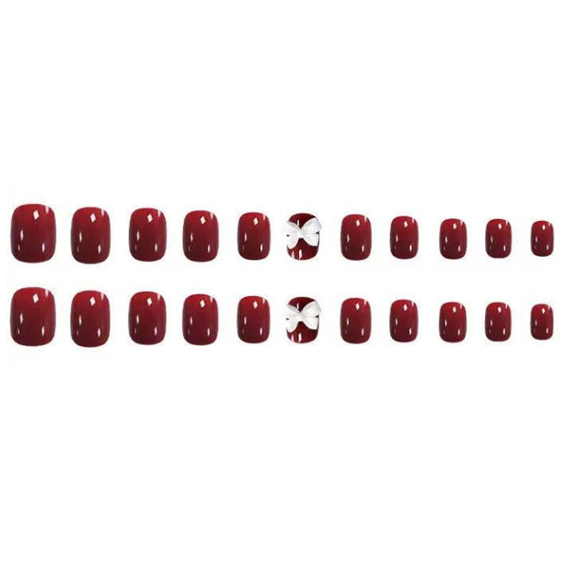 Artificial nails with elegant bow motifs Stornfield