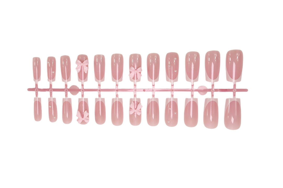Nail art set with playful ribbon designs and elegant accents Stornfield