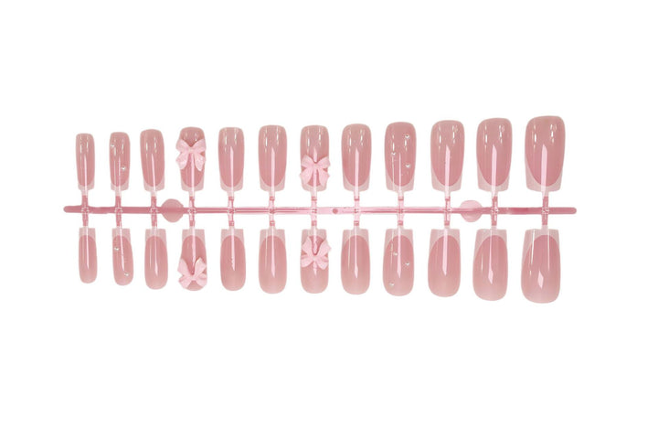 Nail art set with playful ribbon designs and elegant accents Stornfield
