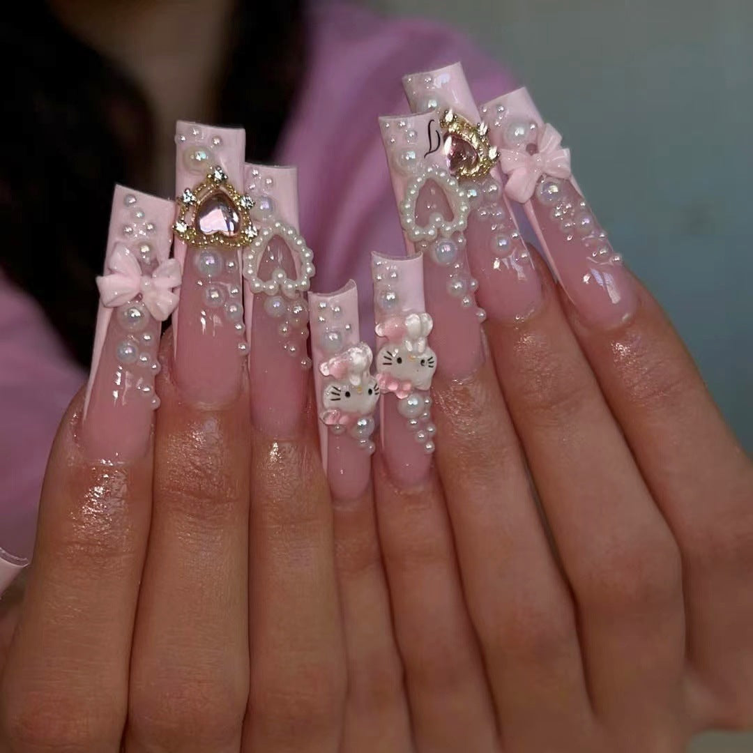 Glamorous artificial nails with 3D decorations and pearl accents Stornfield