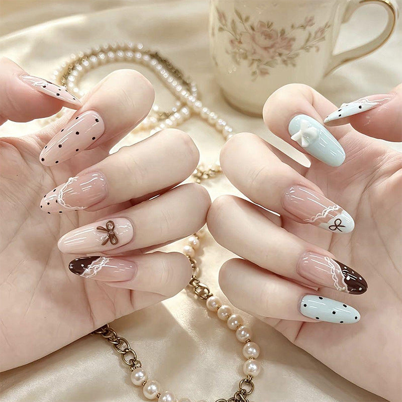Artificial nail set with elegant accents and fine designs Stornfield