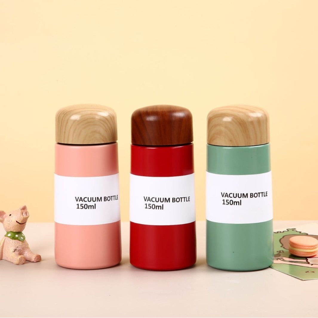 Women vacuum-insulated water bottle with innovative wooden lid Stornfield