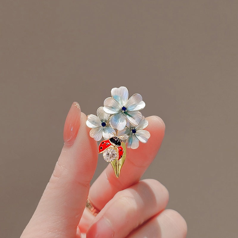 Flower brooch with ladybug and crystal Stornfield