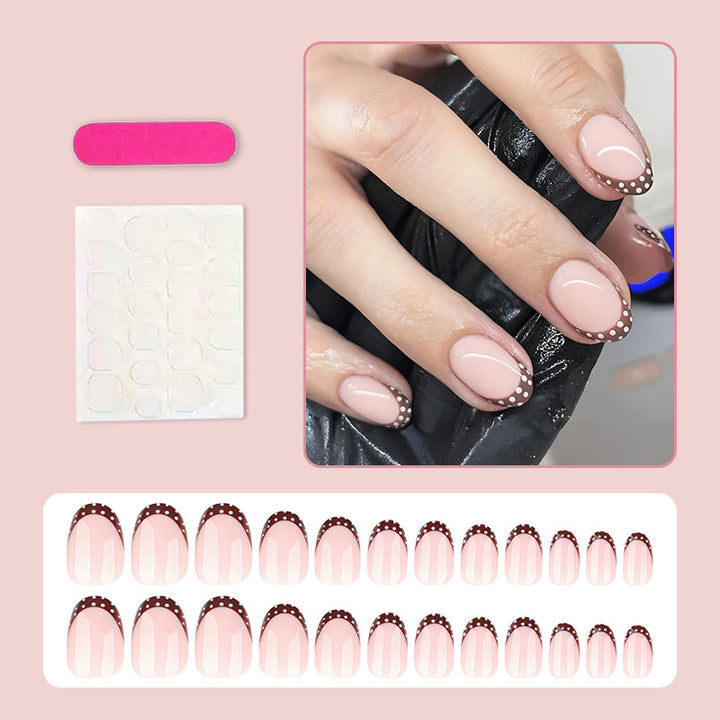 Artificial nail set with elegant French tips and subtle dots Stornfield