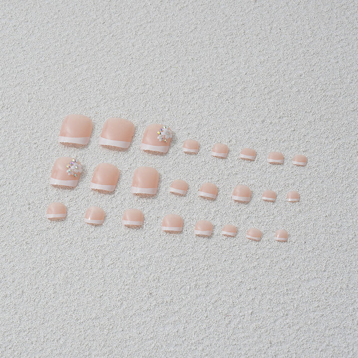 Artificial nail set with elegant French tip design and sparkling accents Stornfield