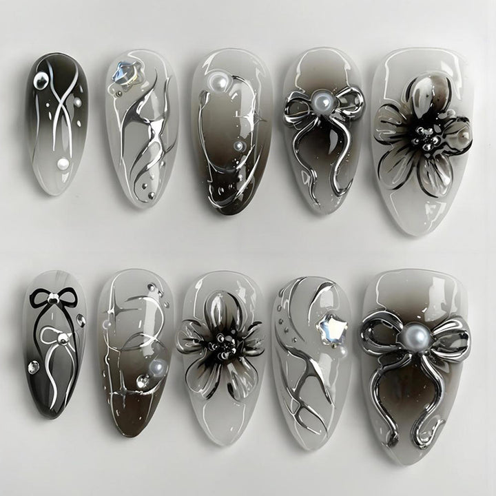 Artificial nails with elegant floral and glittering decorations Stornfield