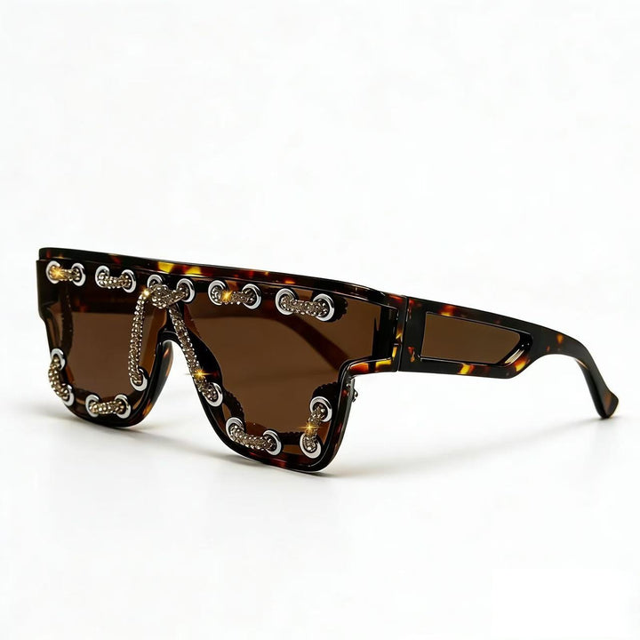 Ladies sunglasses with extravagant design and decorative chain embellishment Stornfield