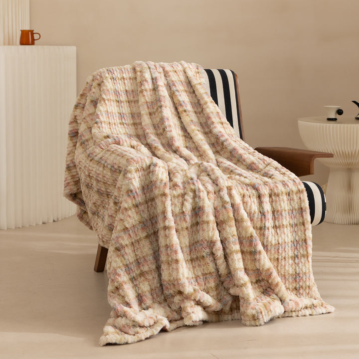Cozy blanket made of luxurious synthetic fur with wavy texture and soft microfiber back Stornfield