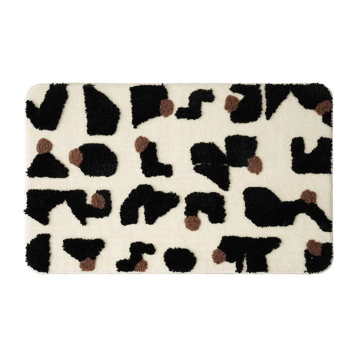 Tufted bathroom mat in abstract leopard pattern with soft high pile Stornfield