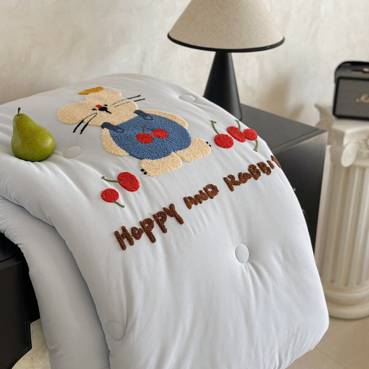 Children's bedding with tufted rabbit appliqué
