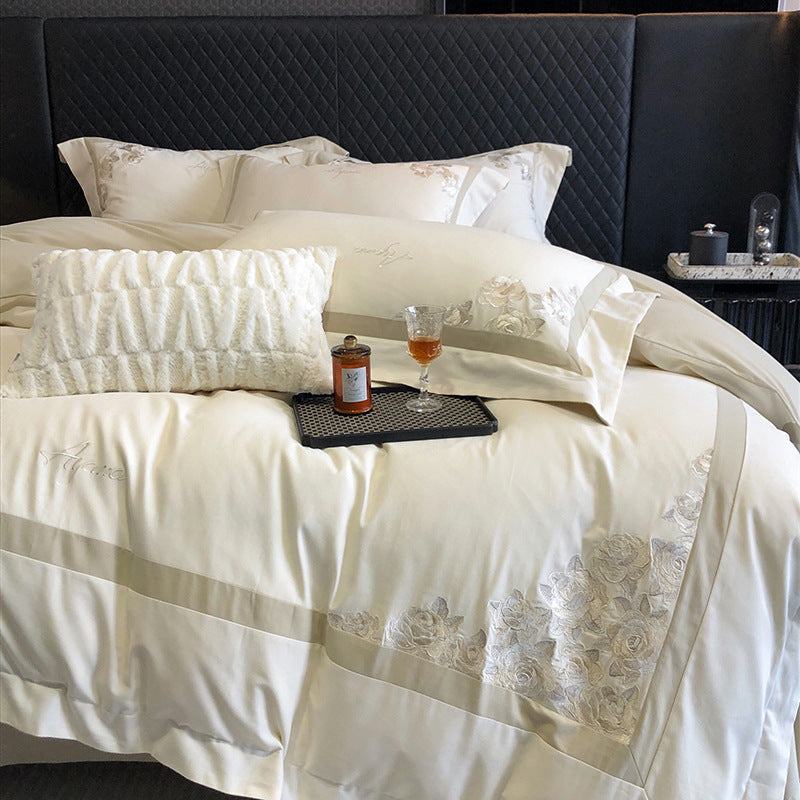 Hotel-style bedding set made of cotton satin with embroidered rose relief and fine border