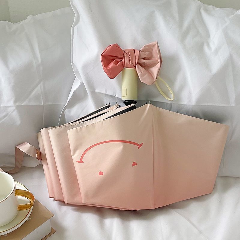 Women's foldable umbrella with playful design and handy wooden handle Stornfield