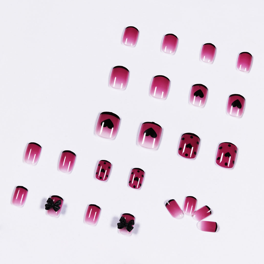 Artistic nail extensions with cute bow and heart designs Stornfield