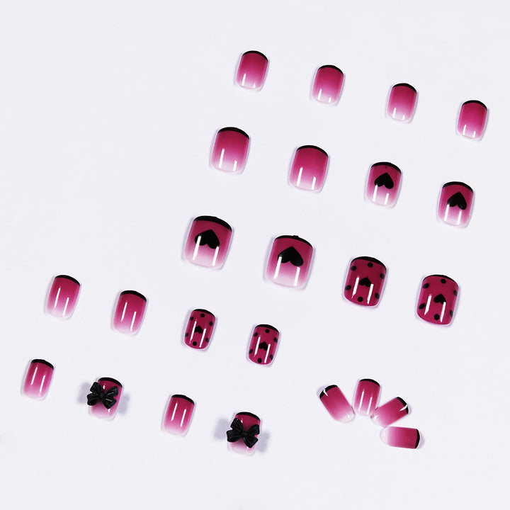 Artistic nail extensions with cute bow and heart designs Stornfield