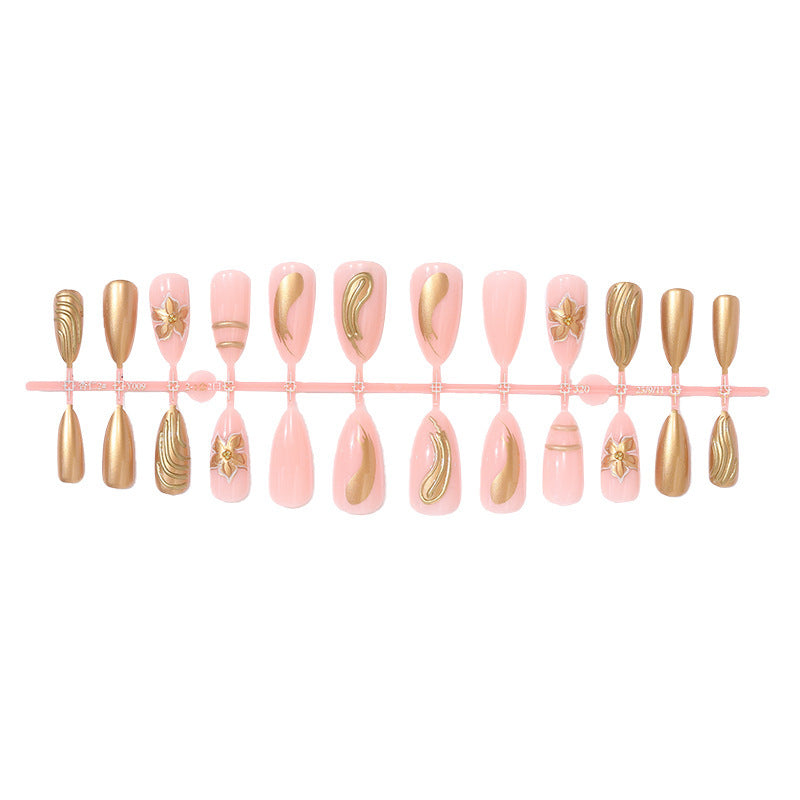 Artificial nail set with elegant golden decorations and delicate designs Stornfield