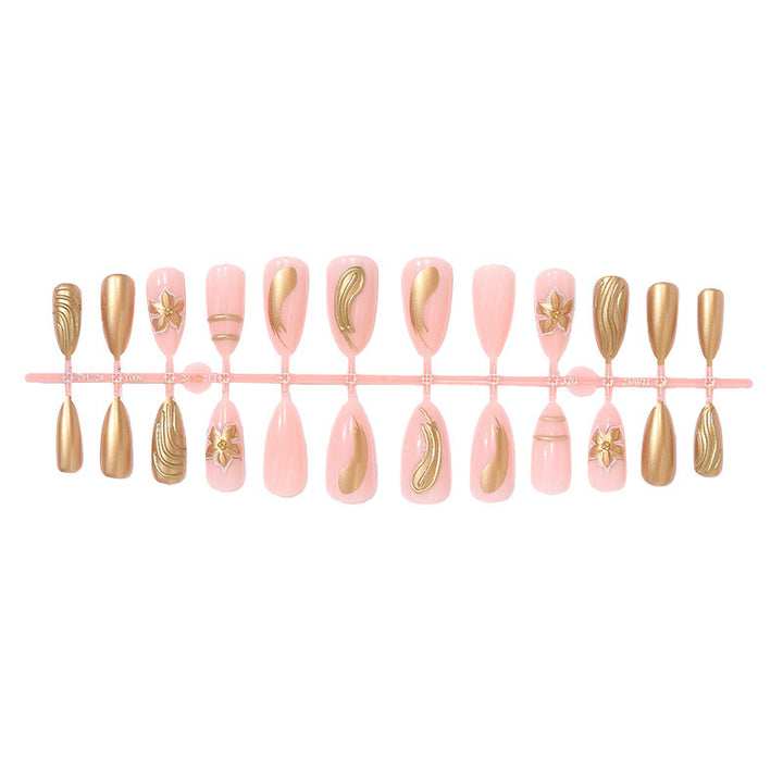 Artificial nail set with elegant golden decorations and delicate designs Stornfield