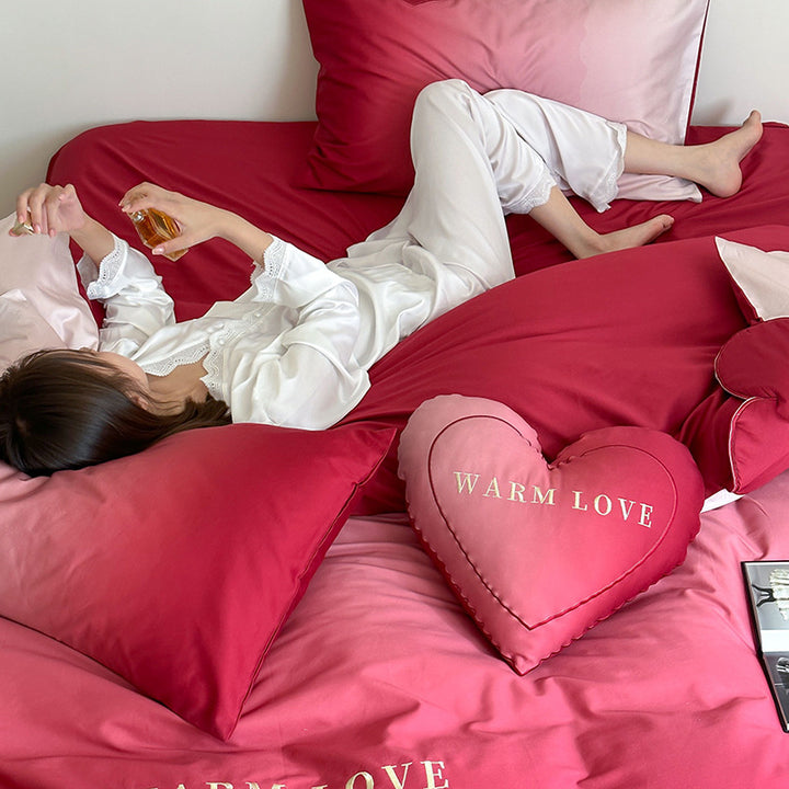 Luxurious satin bedding set with heart pillow and reversible function