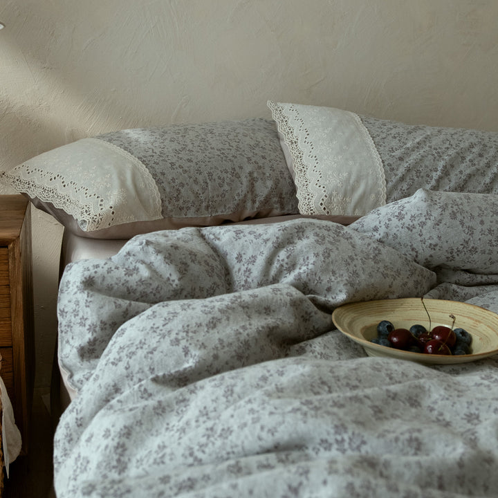 Elegant bedding set made of cotton satin with delicate flower jacquard structure and lace embroidery detail
