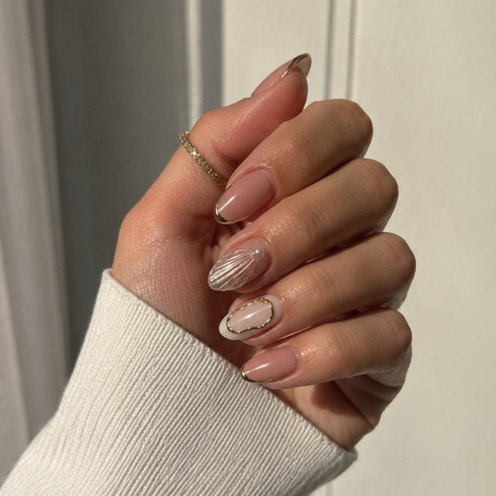 Artistic Press-On Nail Design with Gold Embellishments Stornfield
