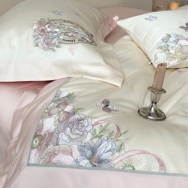 Luxurious floral embroidered cotton satin bedding set with ruffle and decorative pillow Stornfield