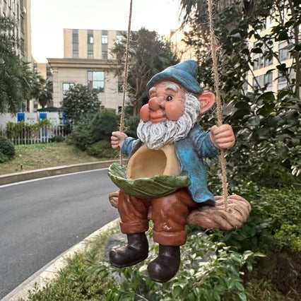 Garden gnome on swing Stornfield