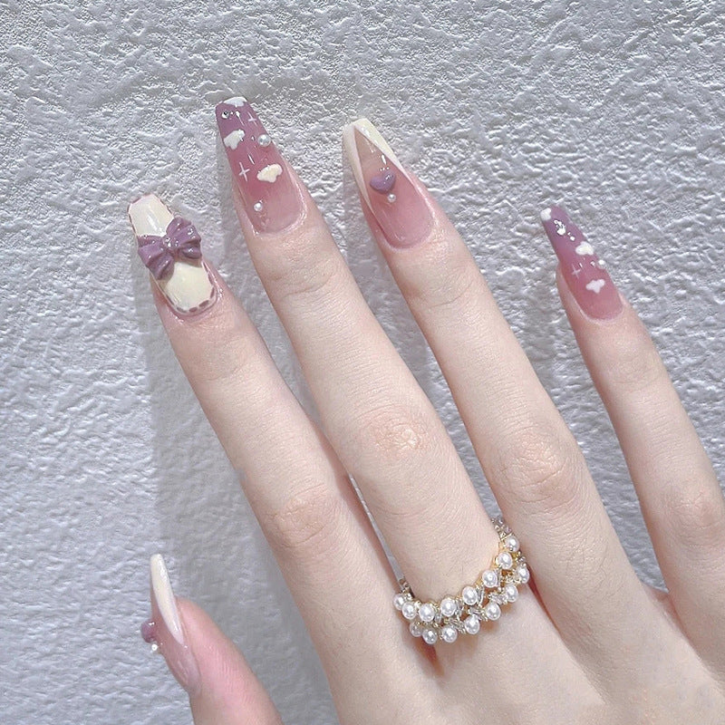 Artificial nails with heart accent and glamorous decorations Stornfield