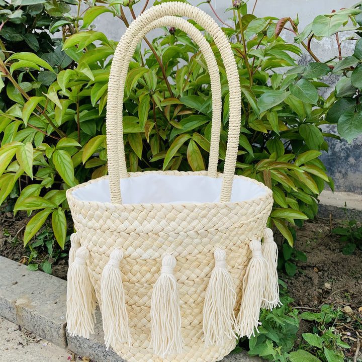 Trendy basket bag with tassels Stornfield