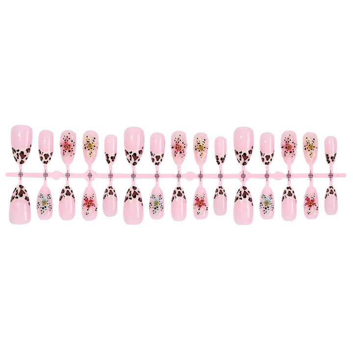 Artificial nail set with exquisite floral design and creative glitter accents Stornfield