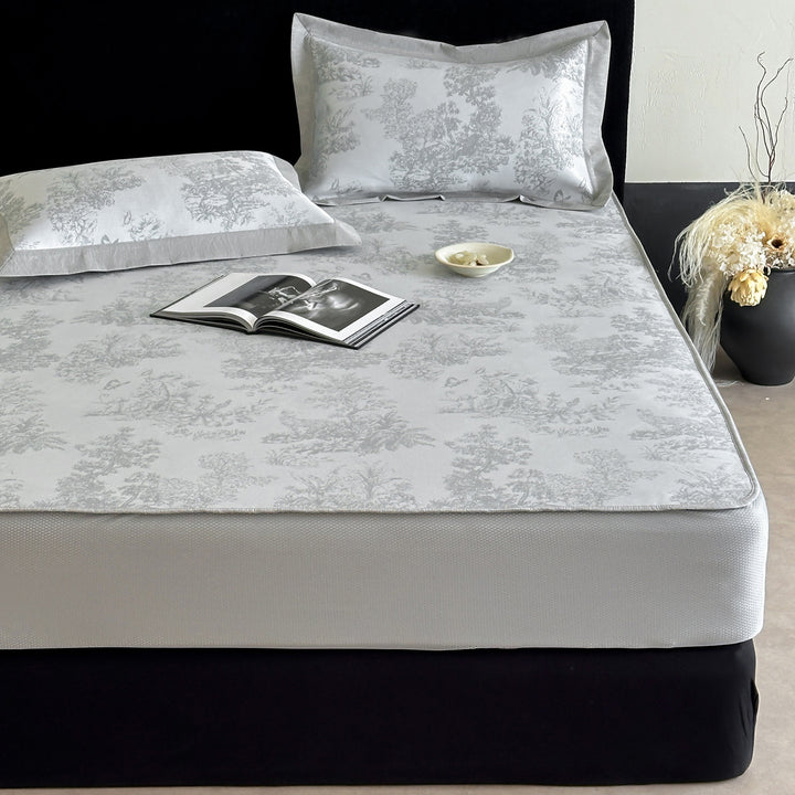 high-quality non-slip mattress protector with integrated fitted sheet and elegant jacquard pattern