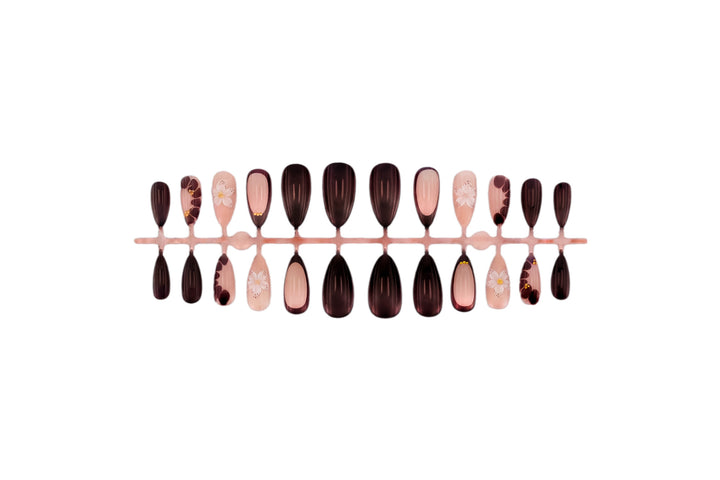 Acrylic nail set with elegant floral patterns and glamour accents Stornfield