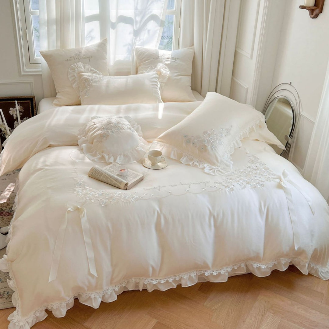 Romantic cotton satin bedding set with ruffles, floral embroidery, and satin bows