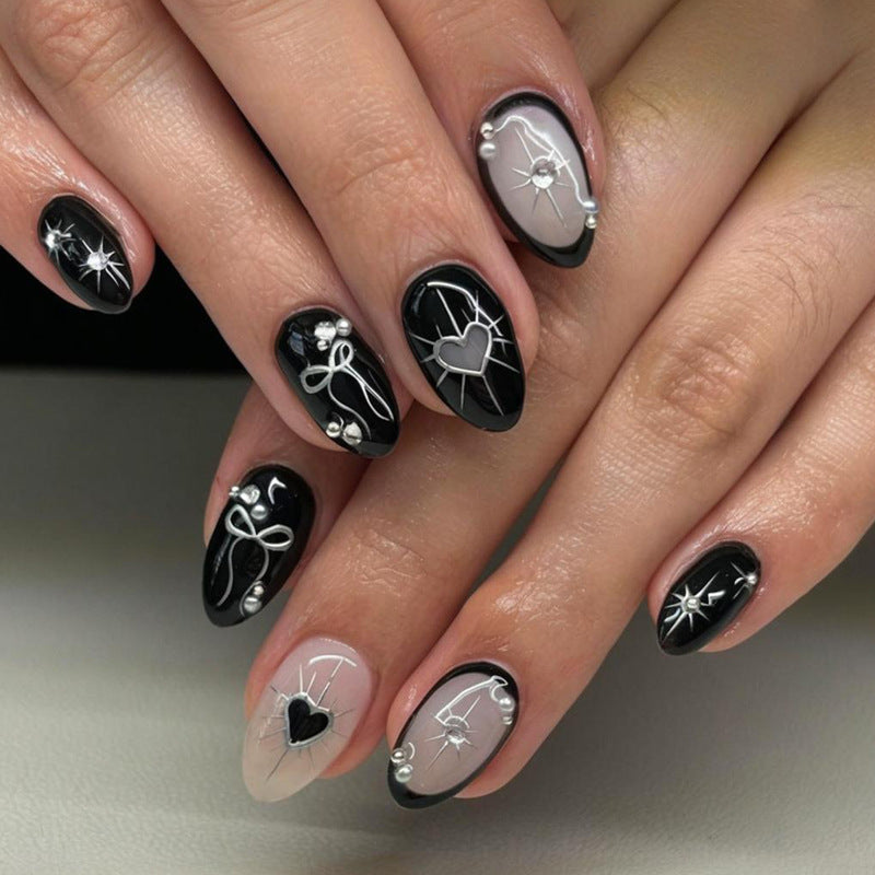 Artificial nail set with elegant bow and heart design Stornfield