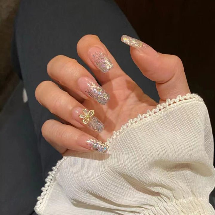 Artful Nail Extensions with Glitter and Decoration Stornfield