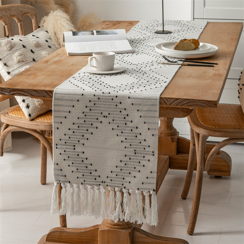 Handwoven table runner made of cotton blend with fringes and geometric dot jacquard Stornfield