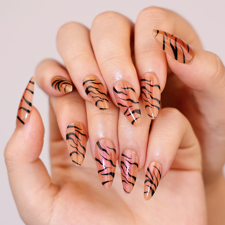 Artful stiletto nails with creative tiger stripe design Stornfield