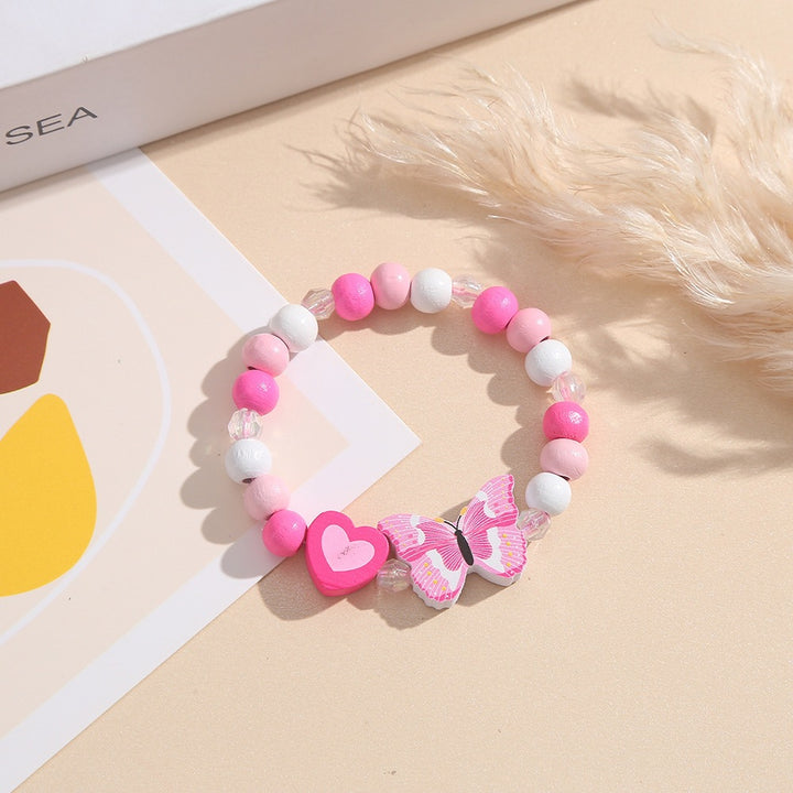 Playful bracelet with heart and butterfly charms Stornfield