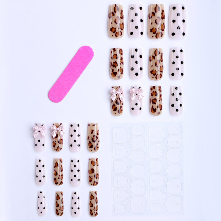 Creative artificial nails with bows and dots Stornfield