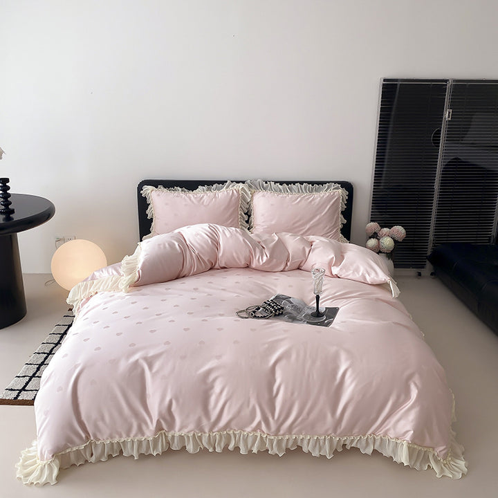 Elegant reversible bedding with romantic ruffle trim and subtle polka dot relief