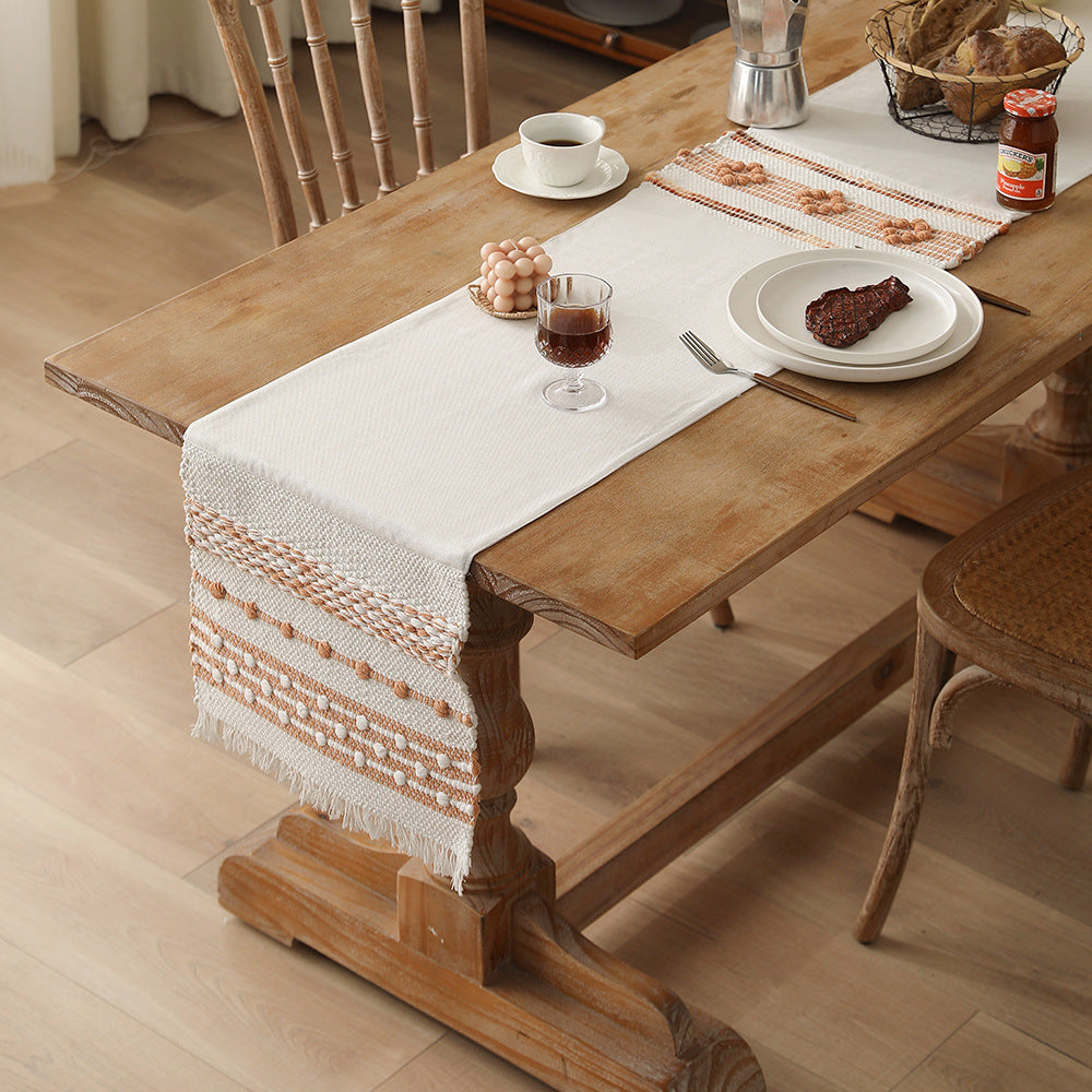 Woven cotton table runner with fringes and textured pattern Stornfield