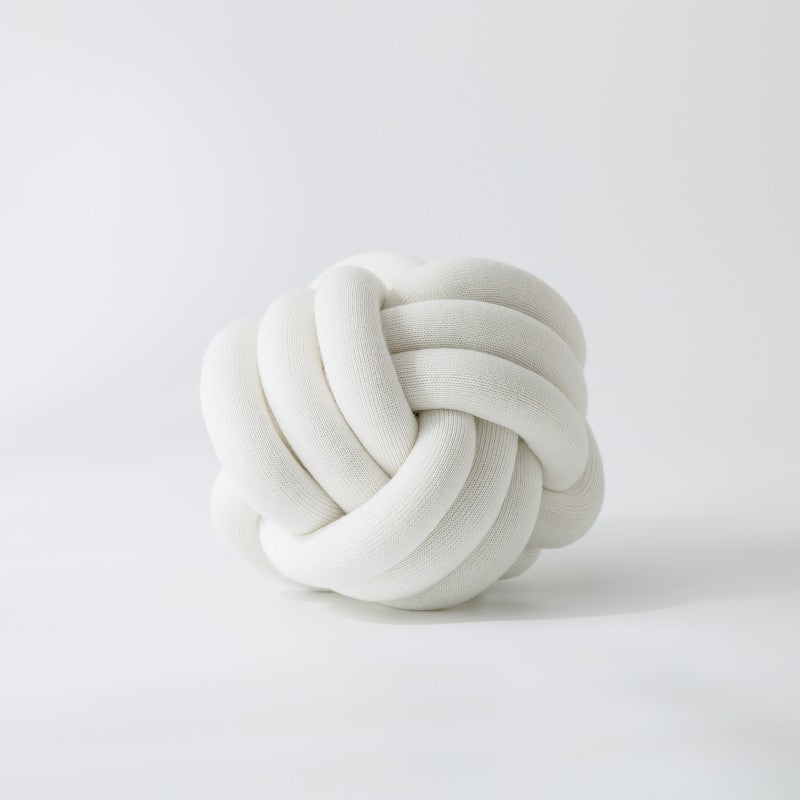 Decorative knitted knot cushion as a decorative pillow made of soft jersey