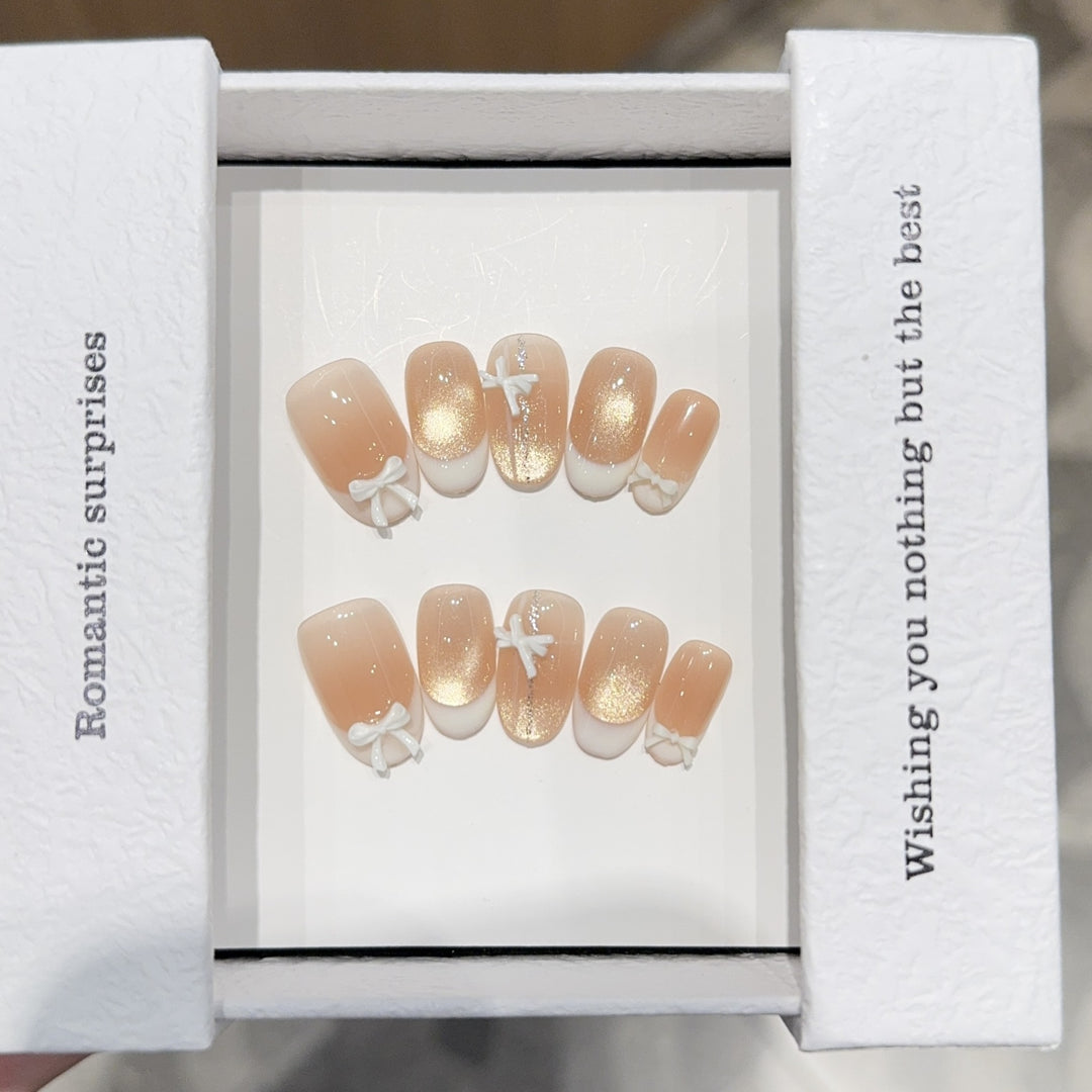 Artificial nails with romantic bow and glitter effects Stornfield