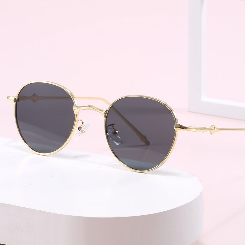 Ladies elegant round sunglasses with stylish metal frame Stornfield