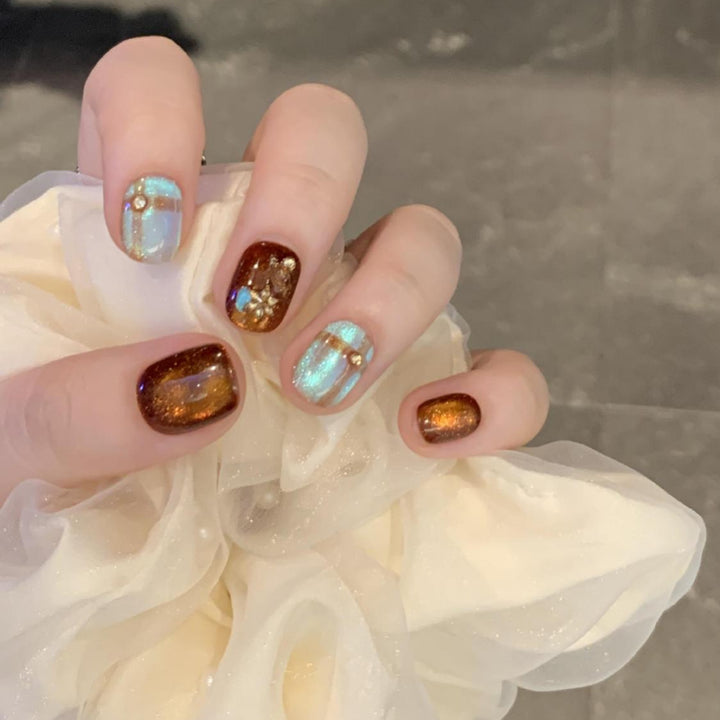 Artificial nail art tips with shimmer and glitter Stornfield